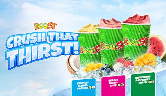 Three colorful smoothie cups with lids on a bed of ice